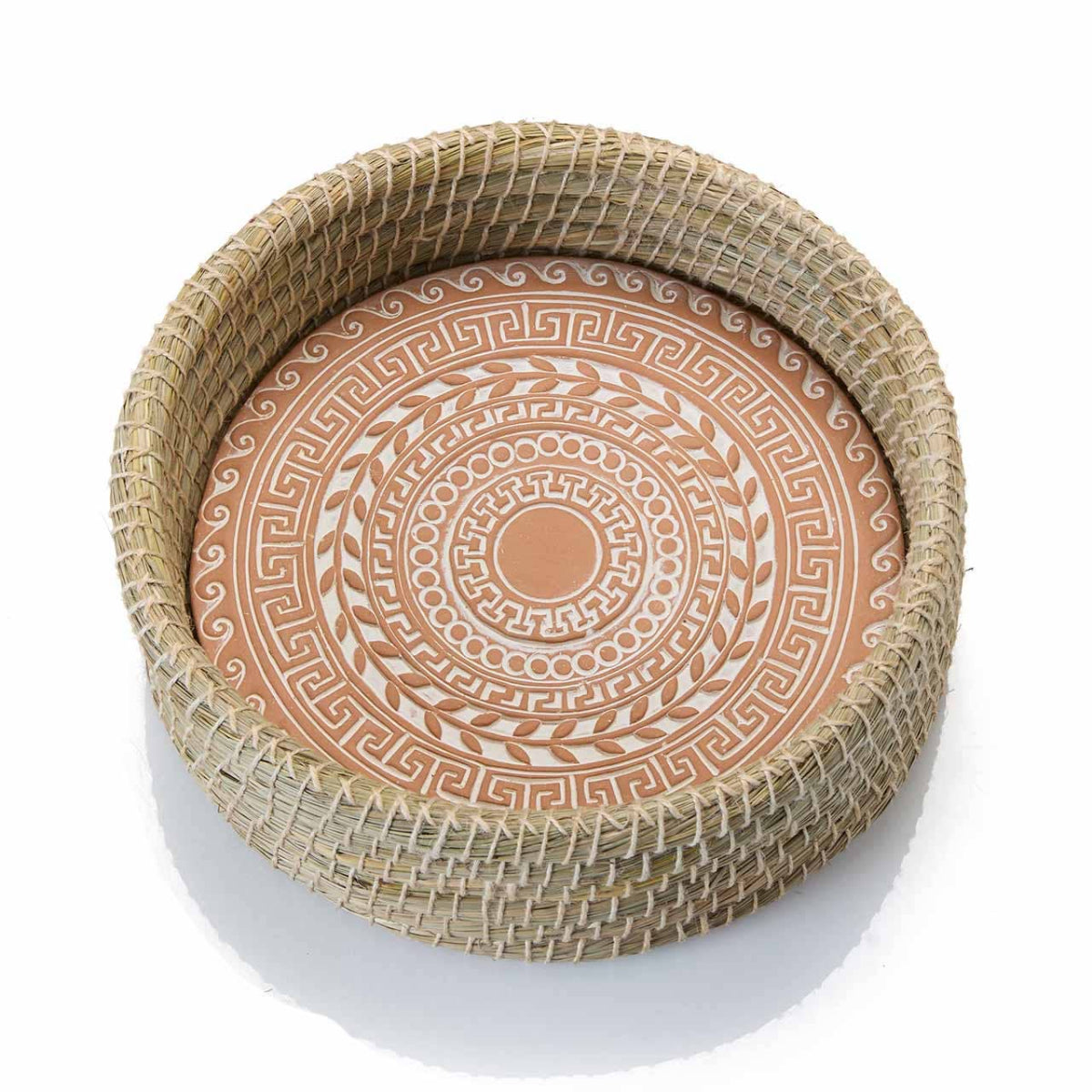 Decorative plate with circular pattern inside a woven rim on a white background