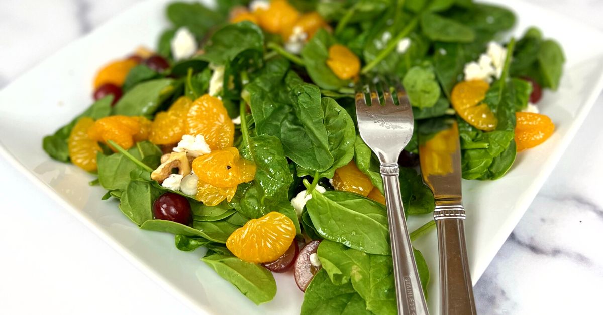 Spinach salad with fruit and Spiced pear vinegar and blood orange olive oil