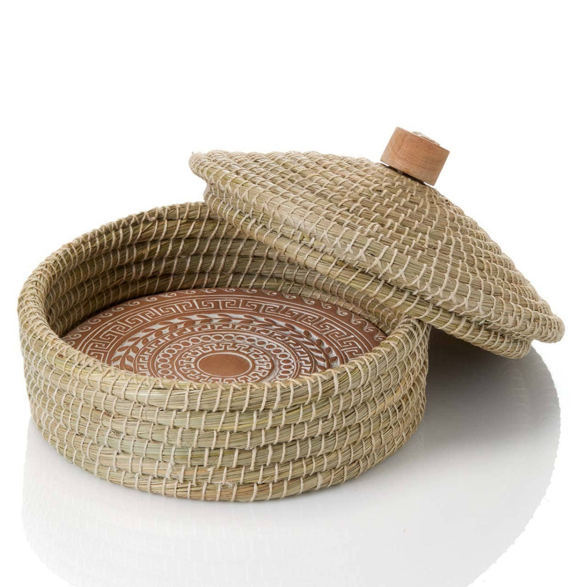 Woven basket with a lid on a white background