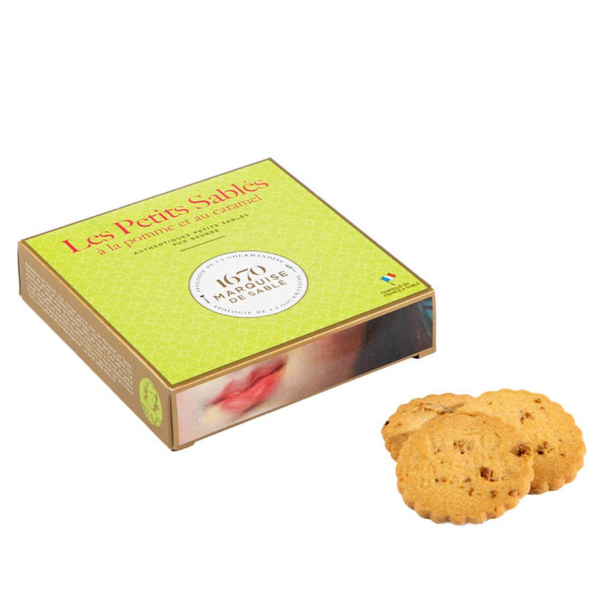 Box of Les Petits Sablés cookies with two cookies on a white background