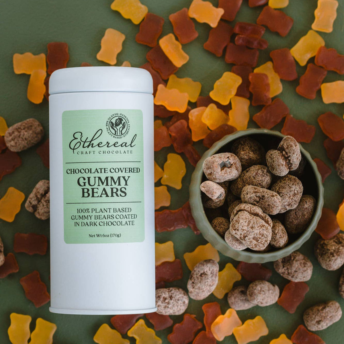 Otherferm chocolate-covered gummy bears with a container on a green background