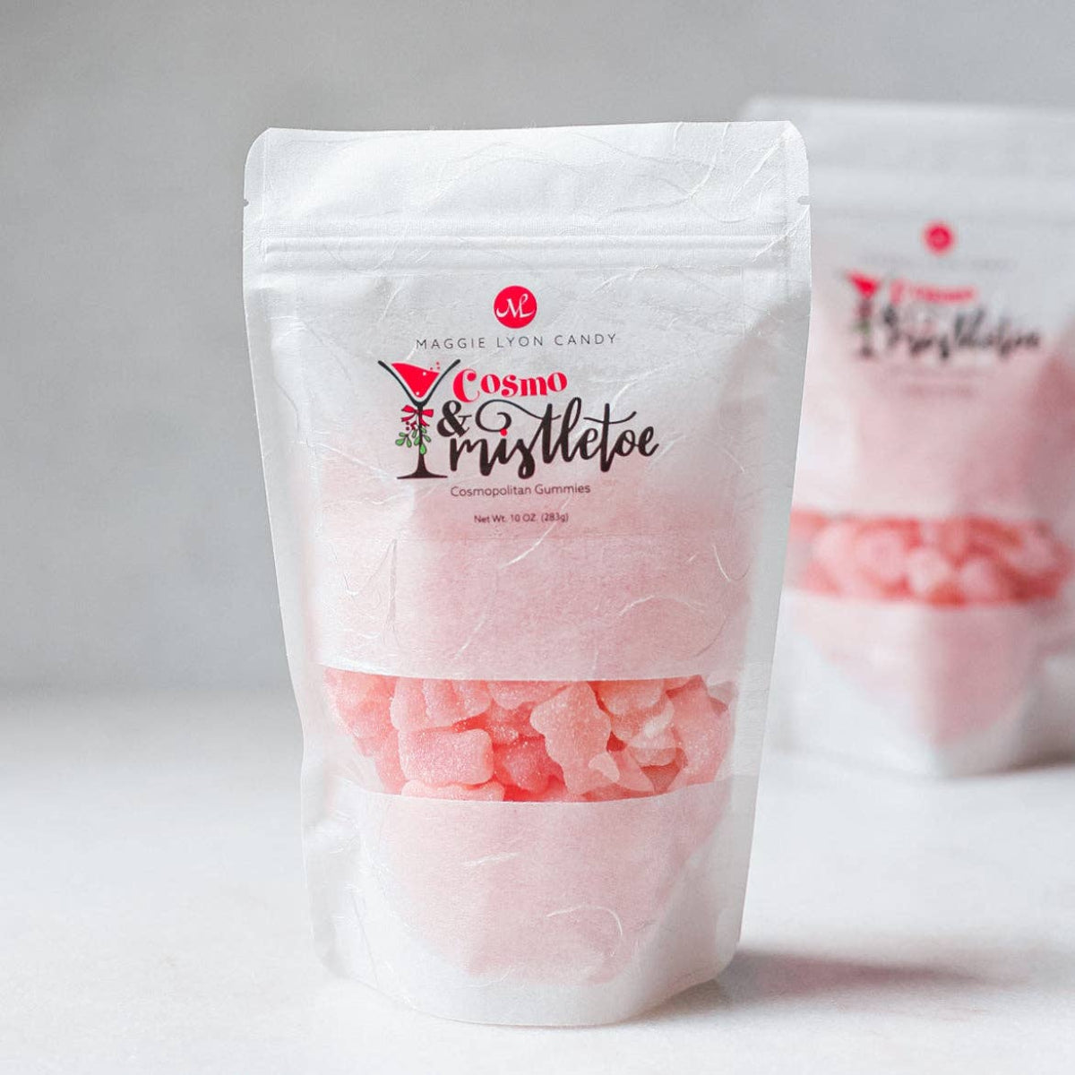 Maggie Lyon Candy Cosmo & Tristeleo pink gummies packaging on a white background