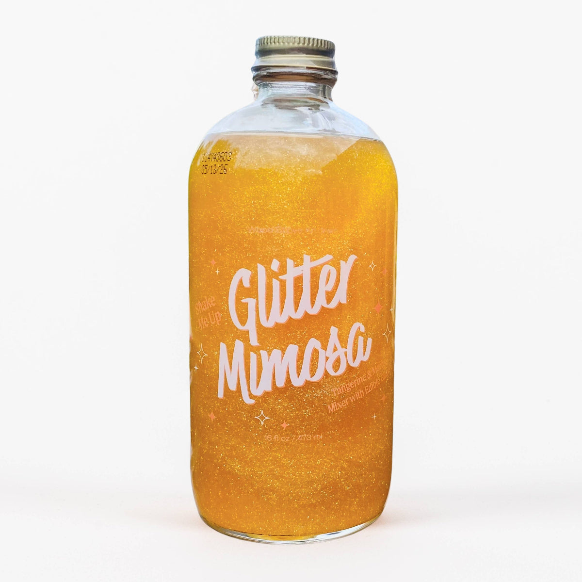 A bottle of Glitter Mimosa Mixer with orange liquid and edible glitter inside, labeled with &#39;Glitter Mimosa&#39; in bold letters.