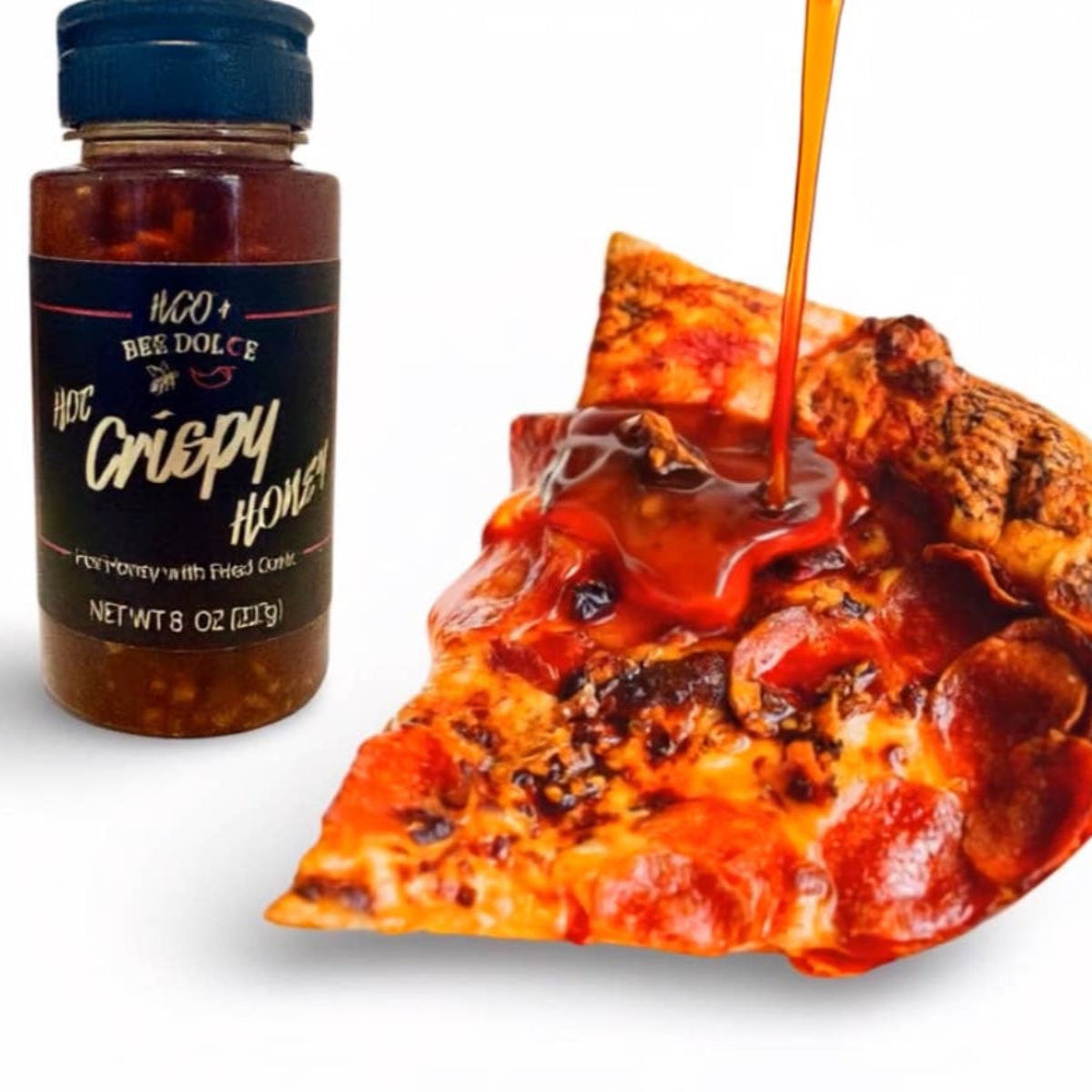 Bottle of honey being drizzled onto a slice of pizza