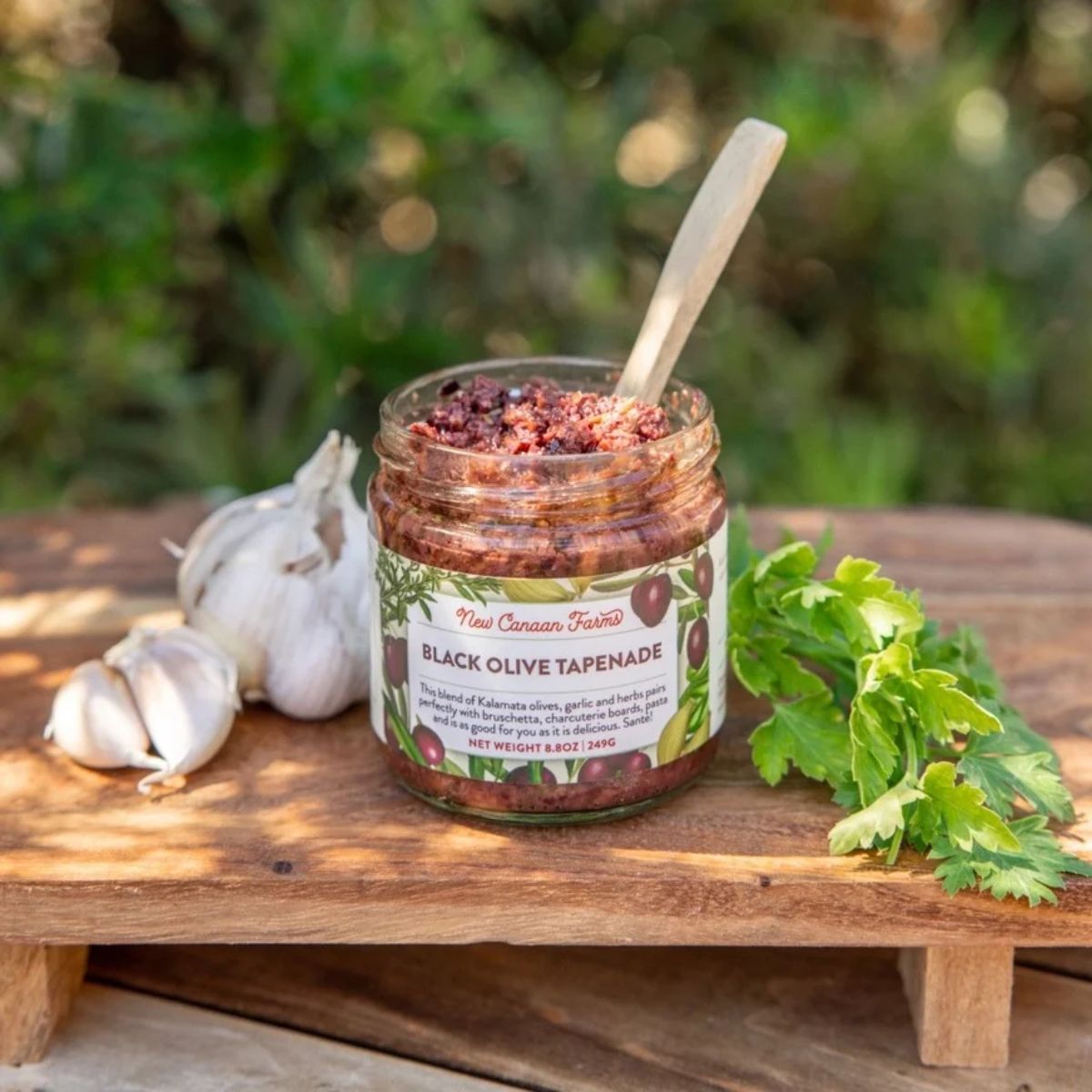 a open jar of black olive tapenade