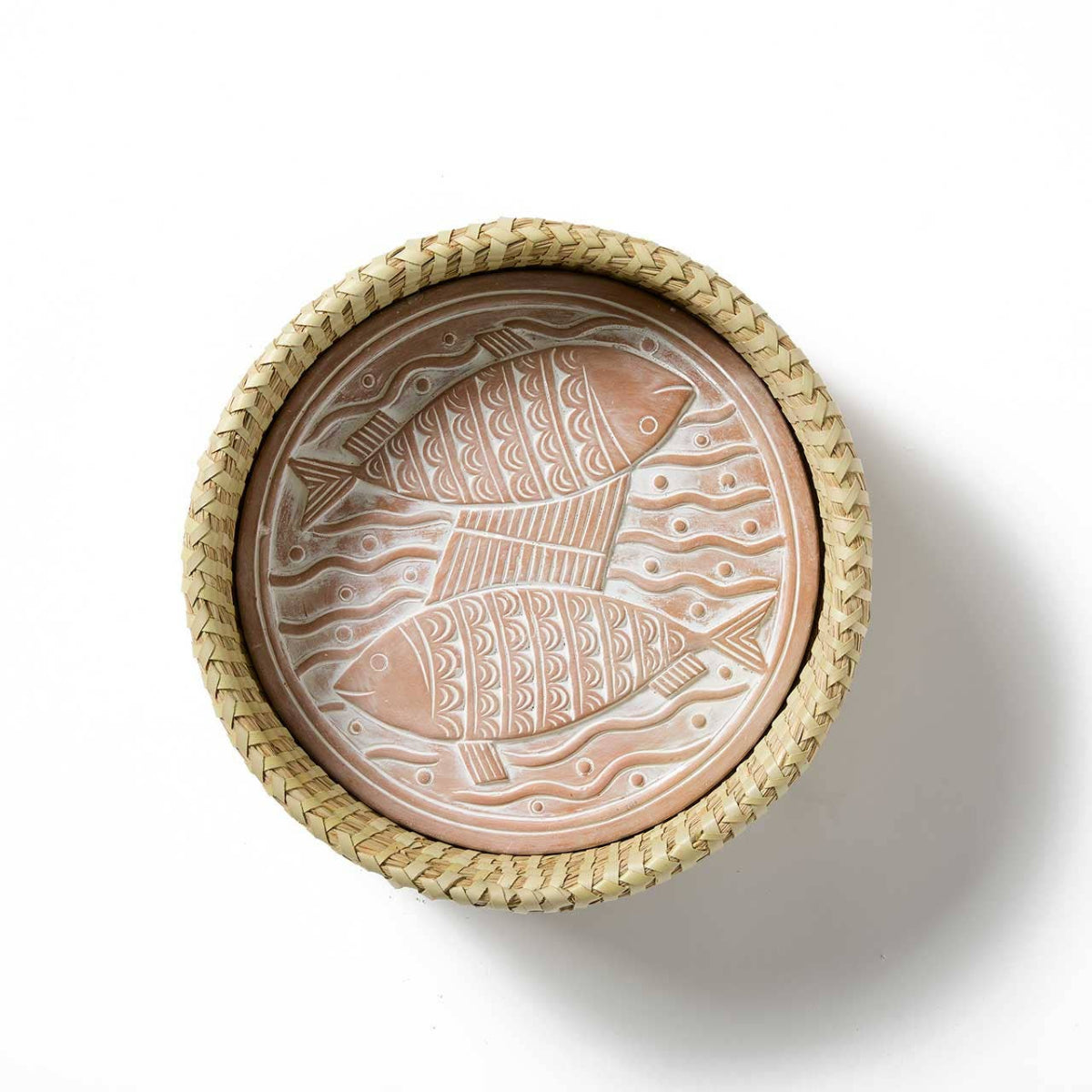 Decorative dish with fish design and wicker rim on a white background