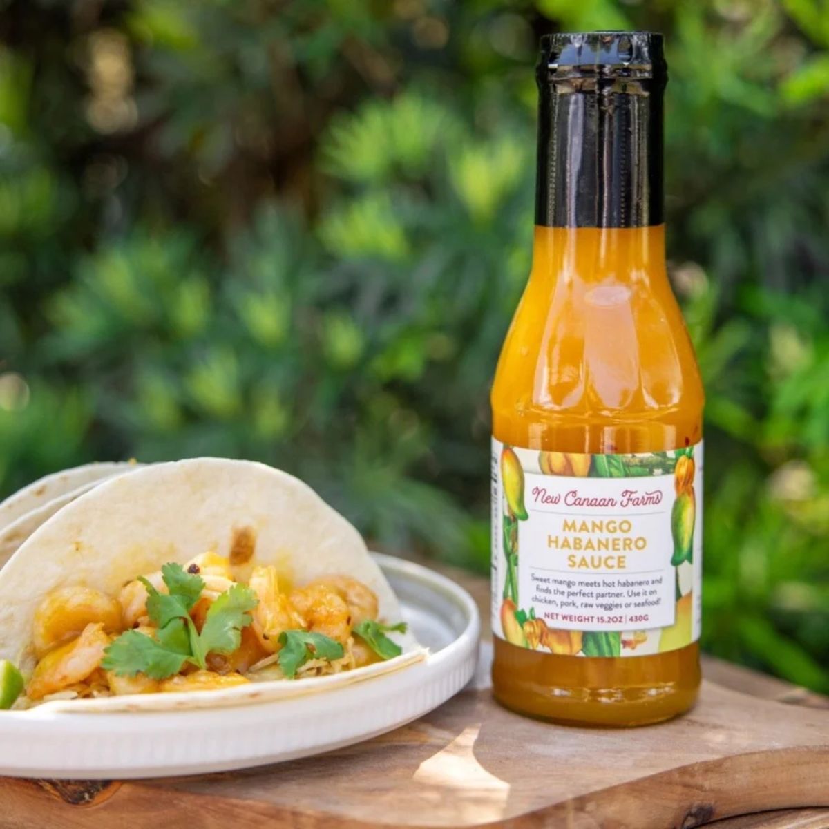 a jar of sauce with shrimp tacos