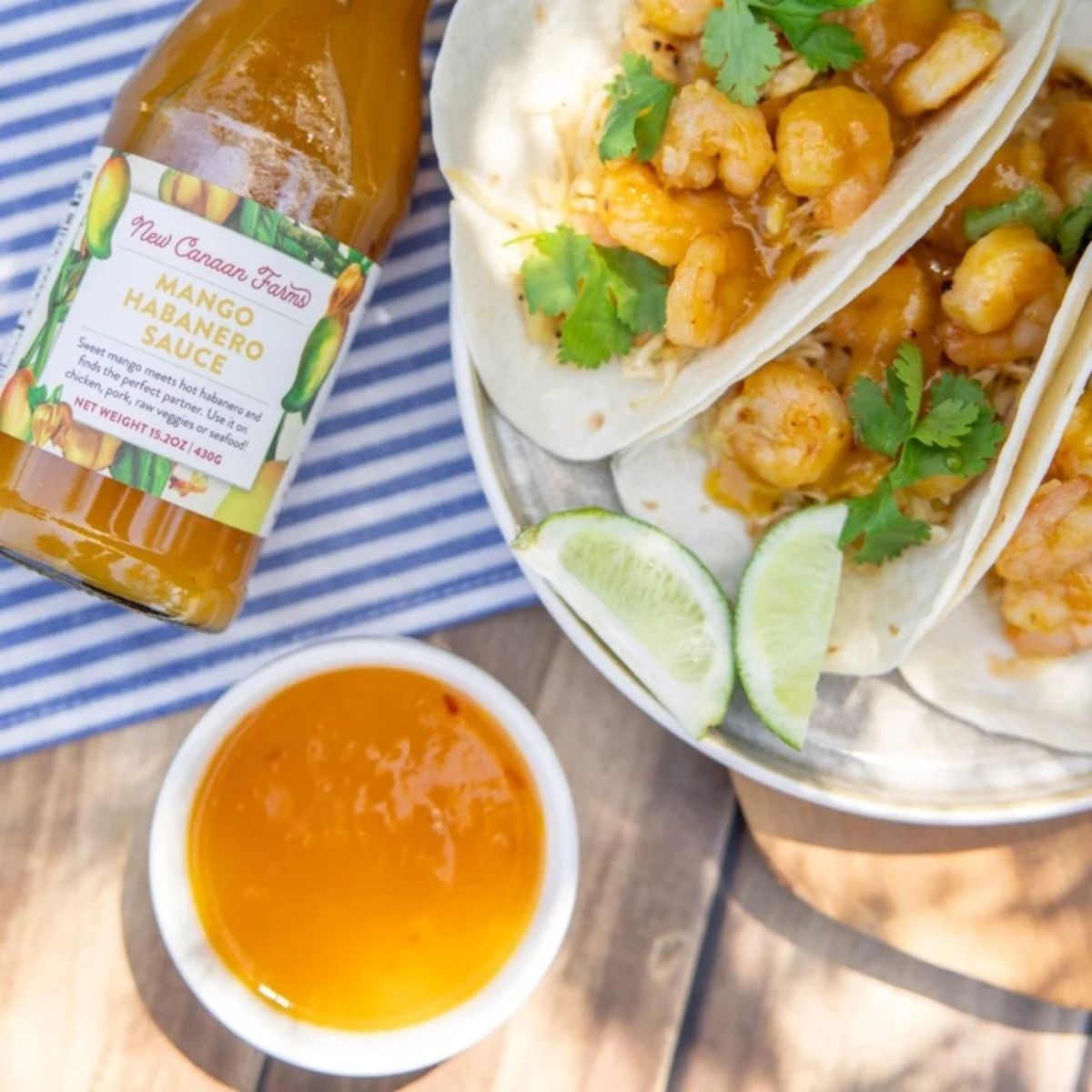a jar of sauce with shrimp tacos