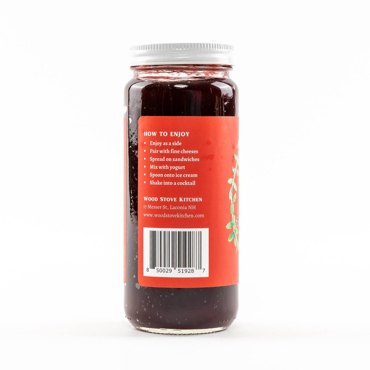 Jar of jelly with a red label on a white background