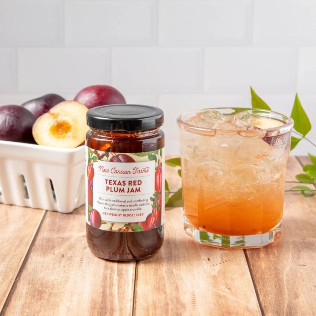 jar of plum jam and a drink