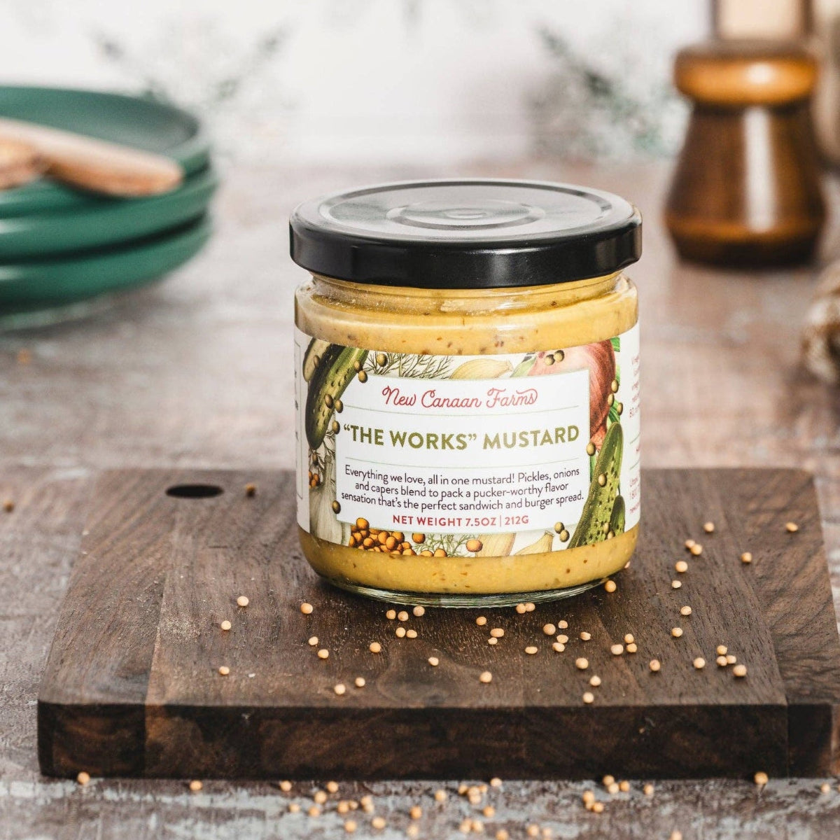 Jar of 'The Works' mustard on a wooden board with a rustic background