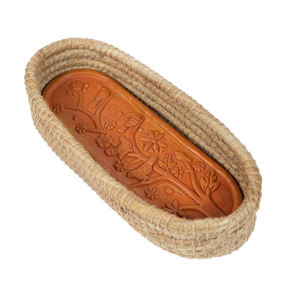 An oval woven basket with a natural beige straw exterior and a carved brown wooden insert featuring floral and bird motifs, shown on a plain white background.
