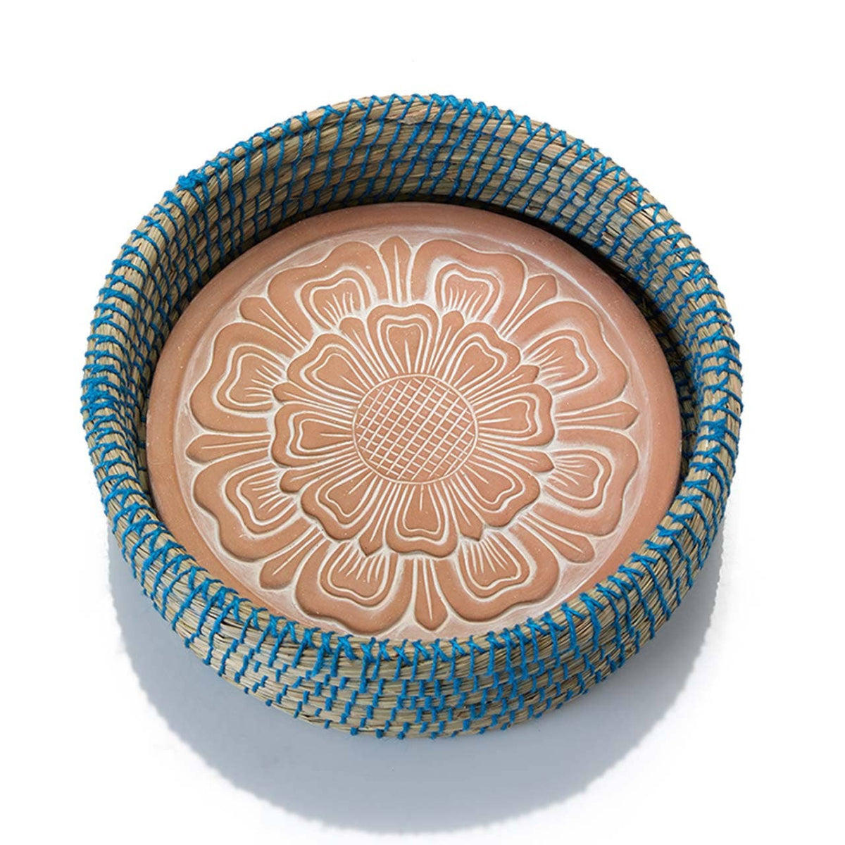 terra cotta dish with blue and beige woven lid on a white background