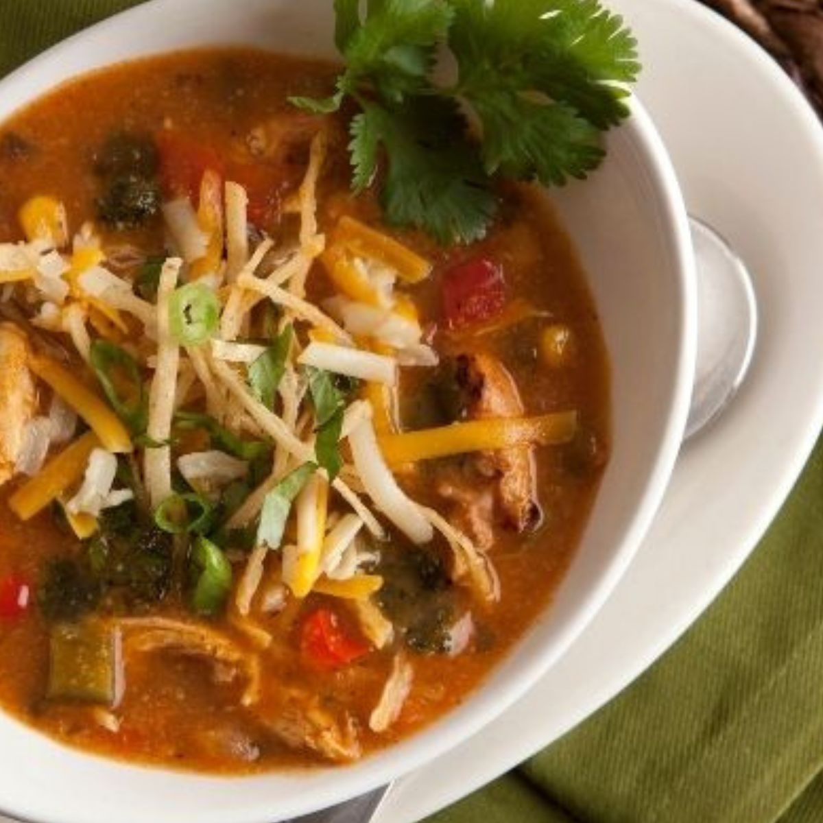 tortilla soup with hatch chili pesto, olive and basket