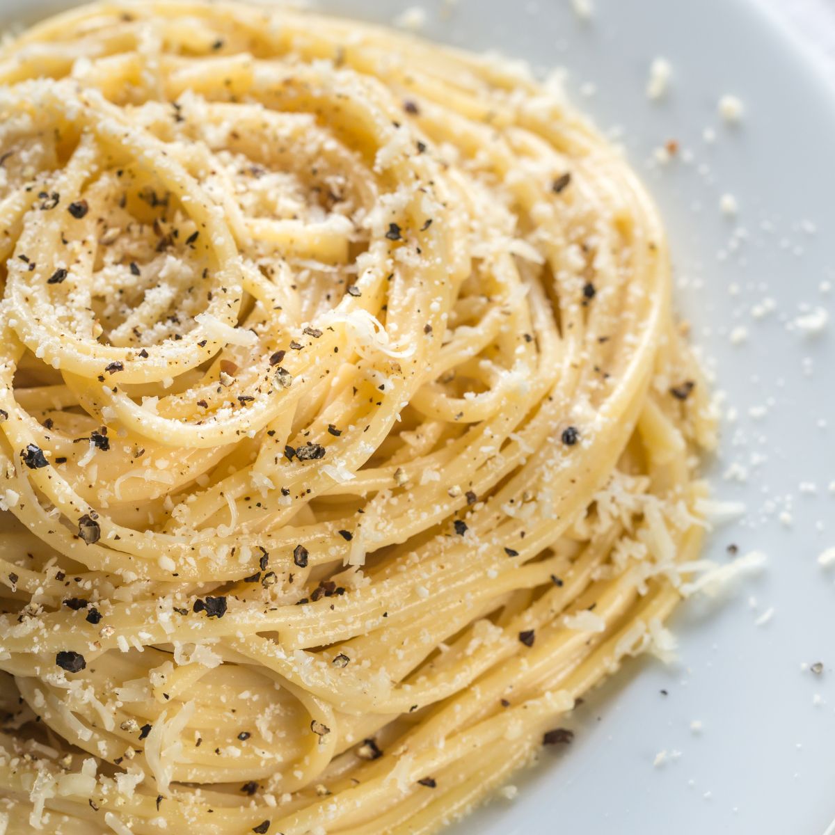 spaghetti with cheese, olive and basket, organic handmade spaghetti